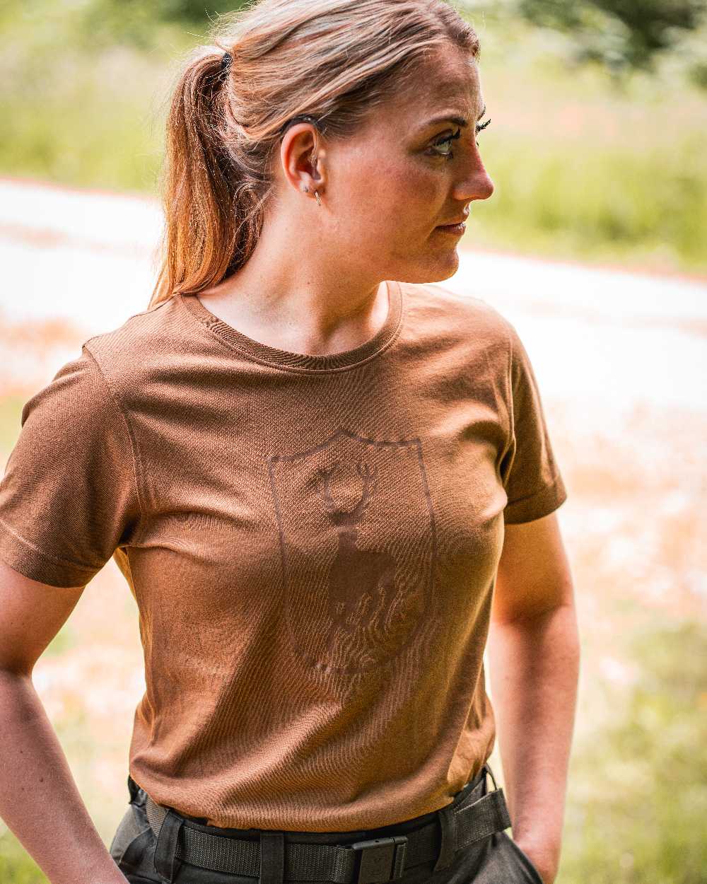 Butternut coloured Deerhunter Lady Logo T-Shirt on blurry background 