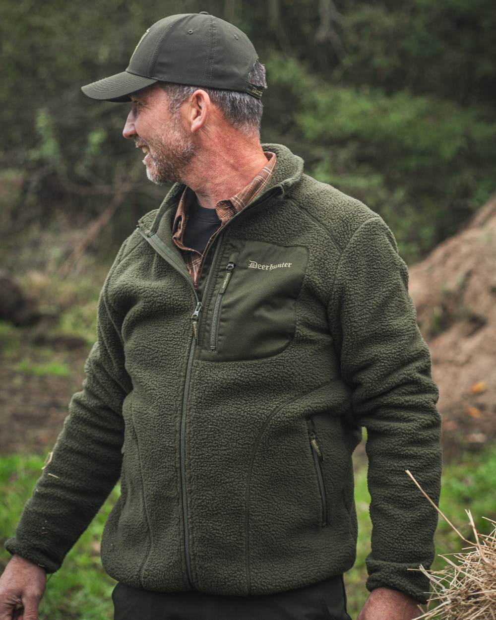 Forest Green coloured Deerhunter Atlas Fleece Jacket on forest background 