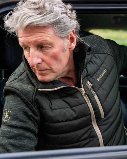 Forest Ember coloured Deerhunter Mens Moor Padded Jacket on car background 