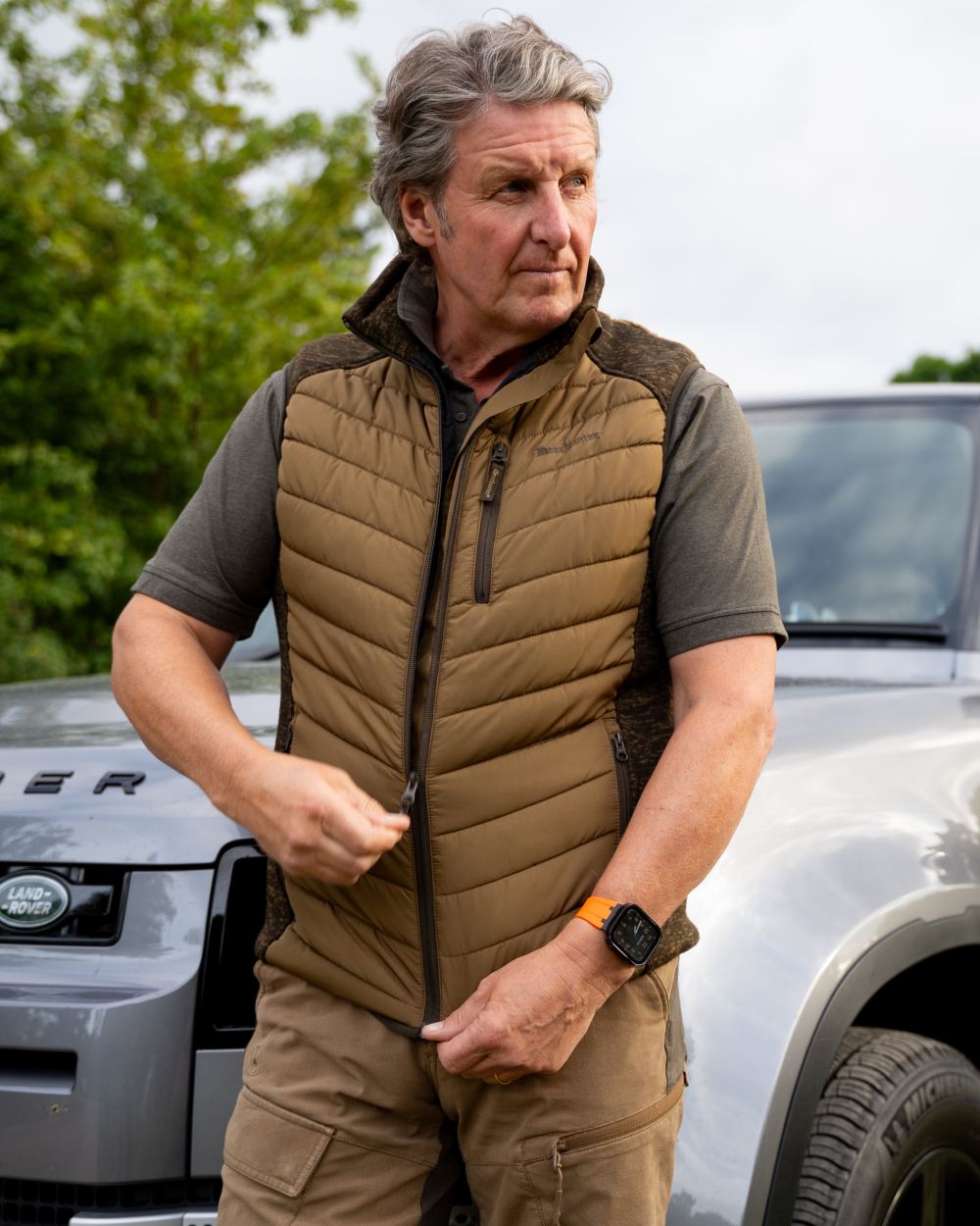 Butternut coloured Deerhunter Mens Moor Padded Waistcoat on car background