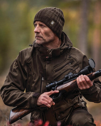 Beluga coloured Deerhunter Recon Knitted Beanie on blurry forest background 