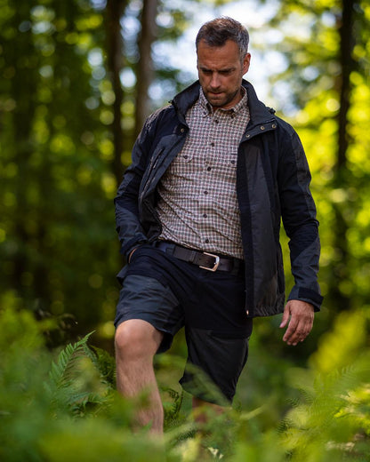 Black Ink coloured Deerhunter Strike Shorts on forest background 