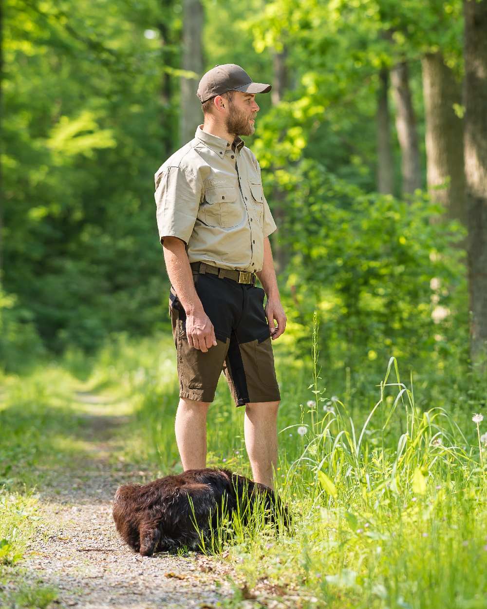 Deep Green coloured Deerhunter Strike Shorts on forest background 