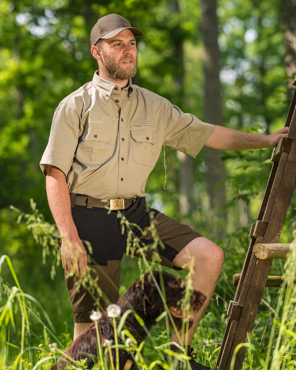 Deep Green coloured Deerhunter Strike Shorts on forest background 