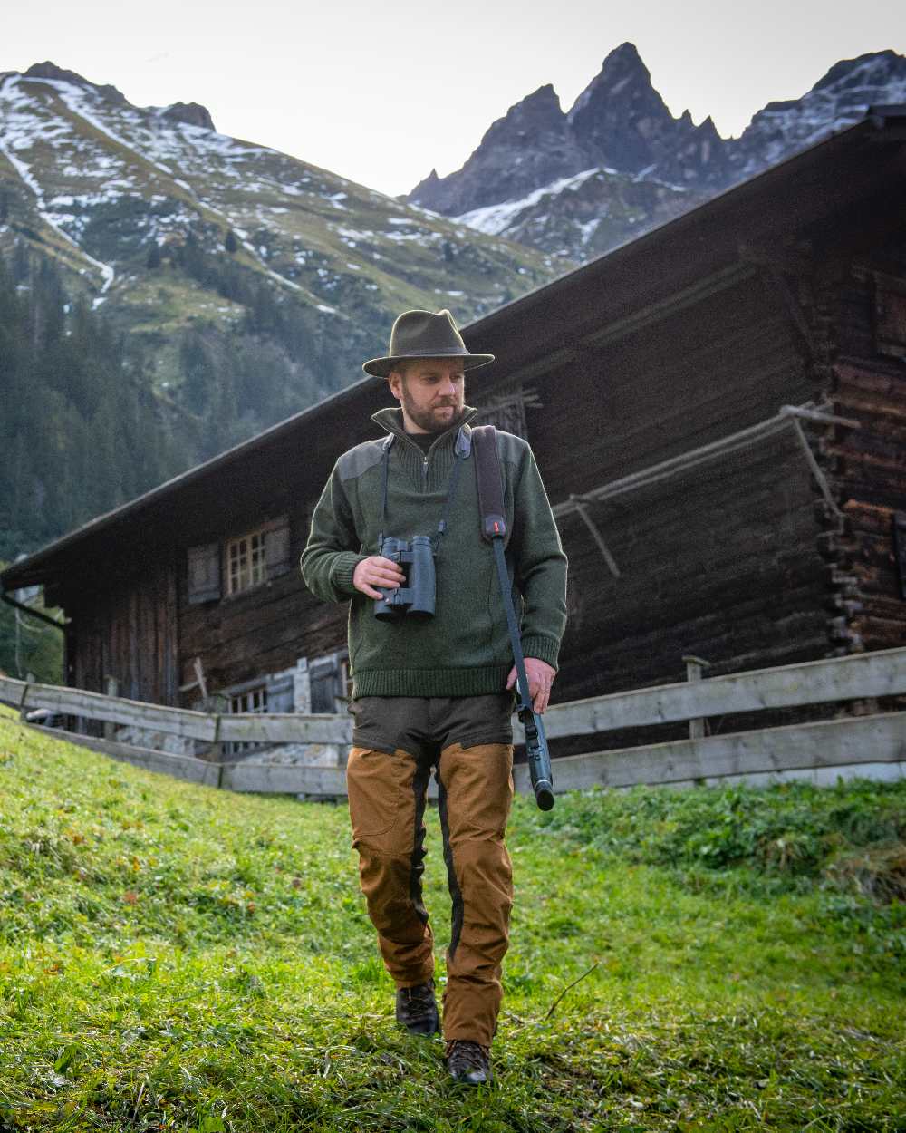 Bronze coloured Deerhunter Strike Trousers on mountain background 