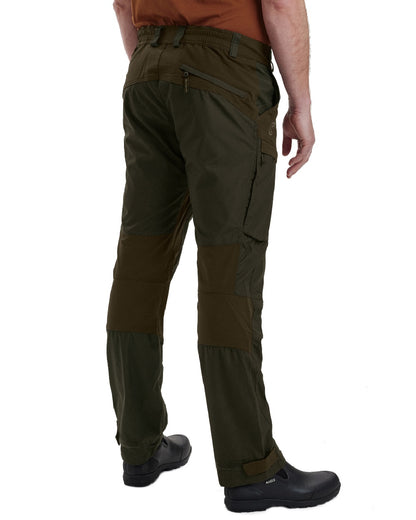 Deep Green coloured Deerhunter Strike Trousers on white background 