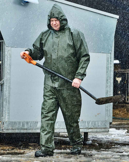 Olive Coloured Elka Light Waist Trousers on construction background 