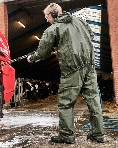 Olive Coloured Elka Light Waist Trousers on construction background 