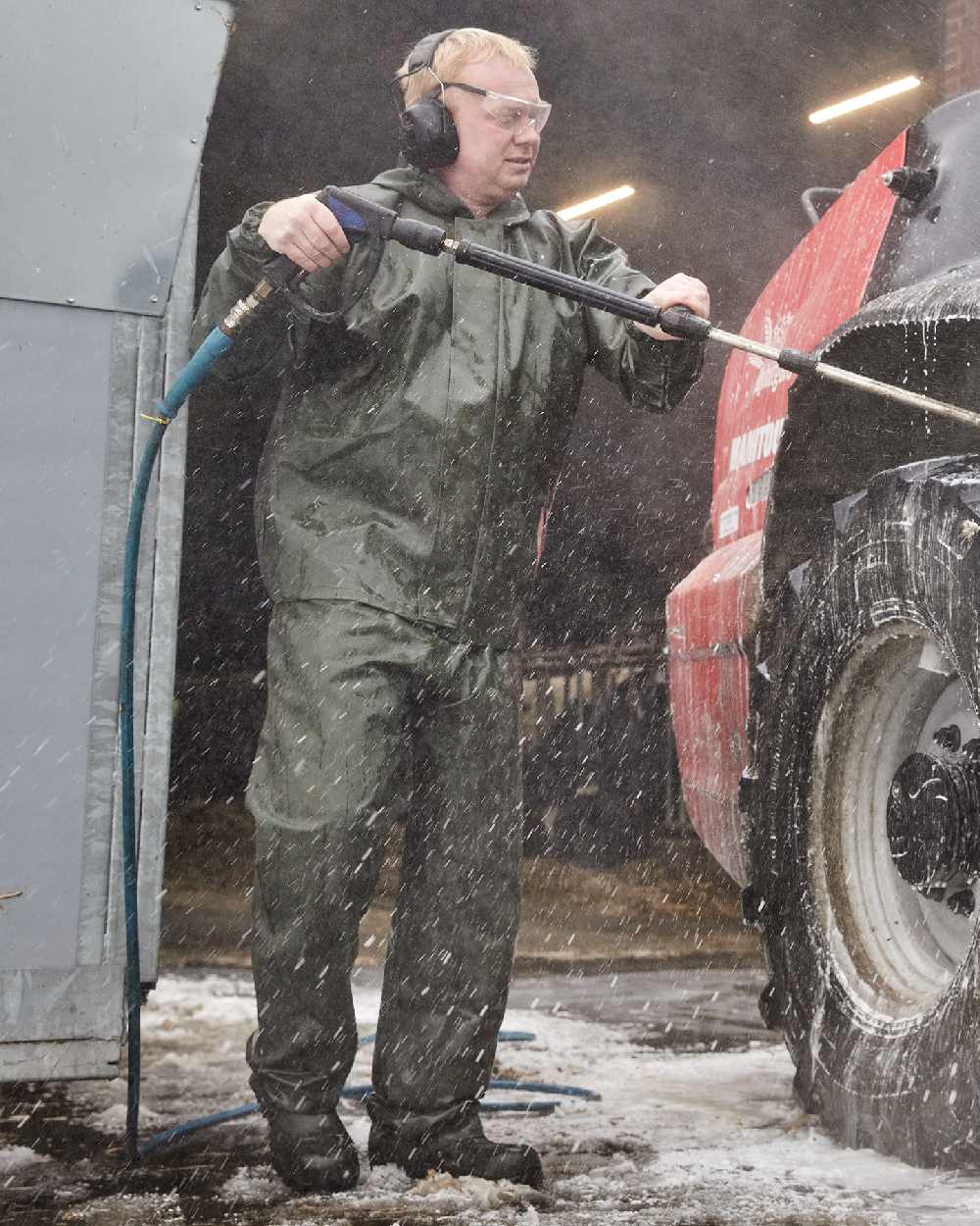 Olive Coloured Elka Light Jacket on construction background 