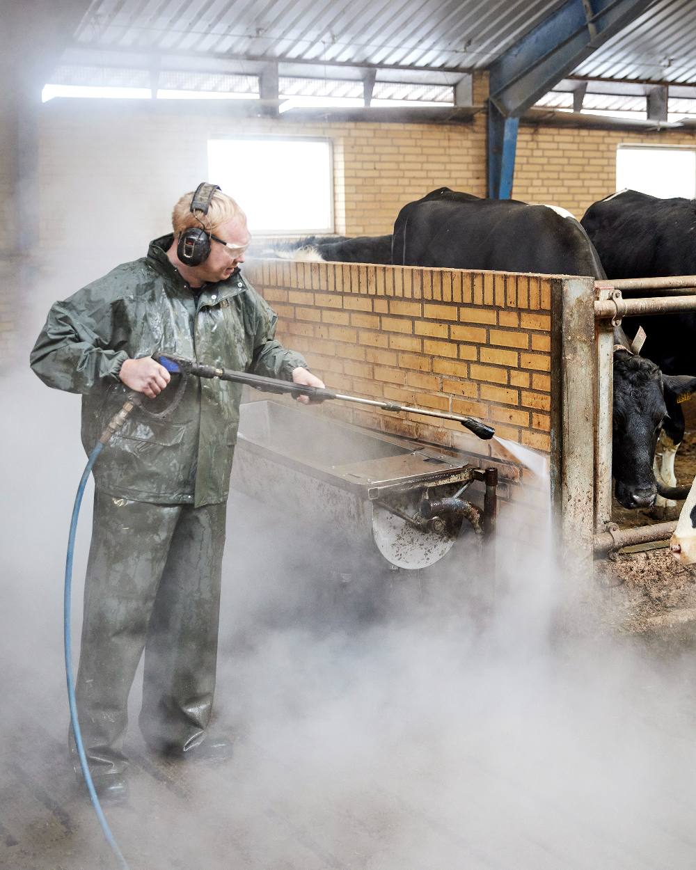 Olive Coloured Elka Mens Elastomer/PVC Bib & Brace on barn background