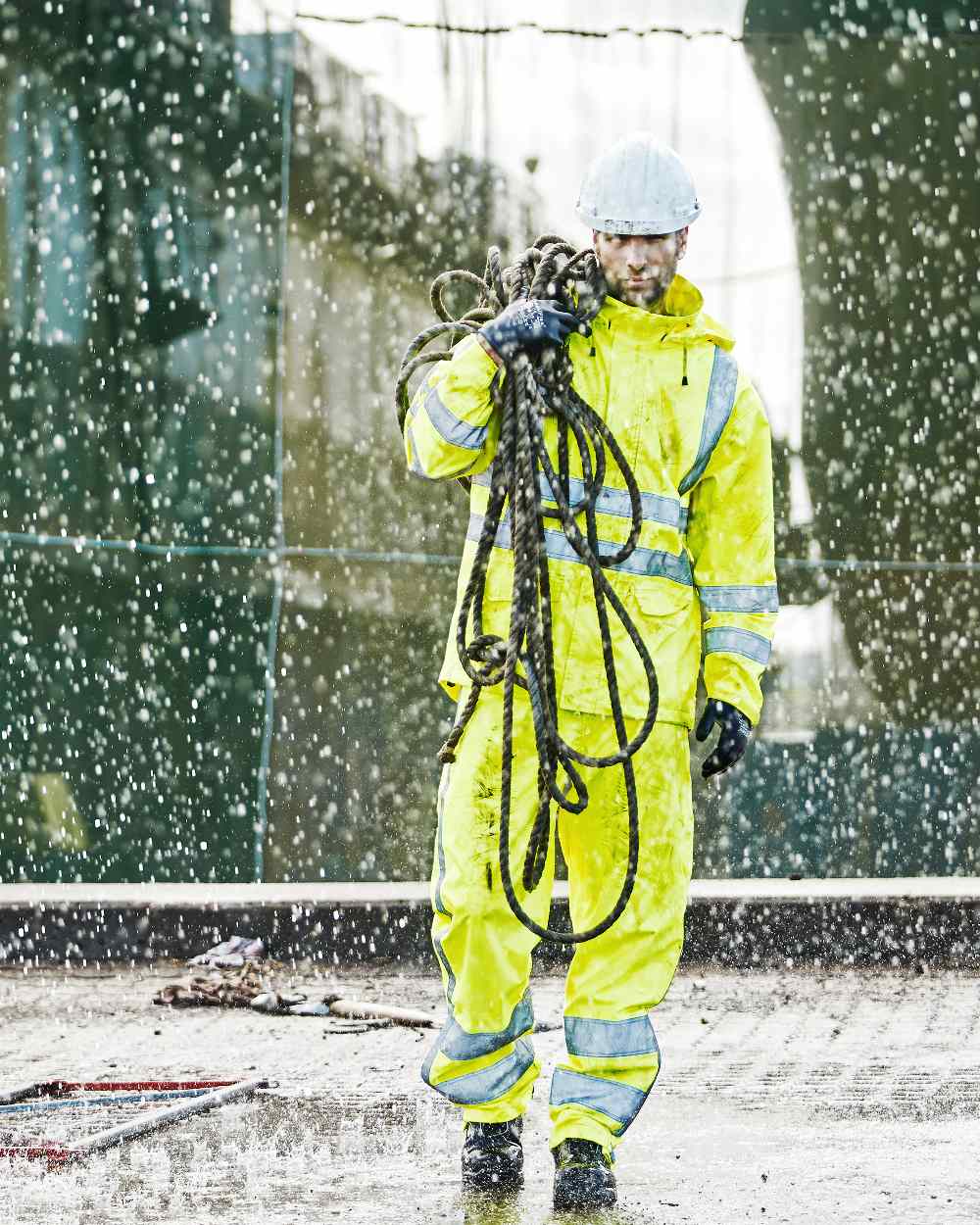 Fluorescent Yellow Coloured Elka Mens Visible Xtreme Rain Trousers With Reflective Tape on rain background 