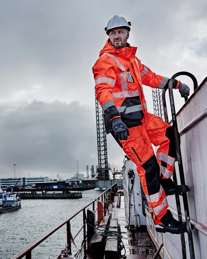 Fluorescent Orange Black Coloured Elka Mens Visible Xtreme Stretch Jacket on sea background 