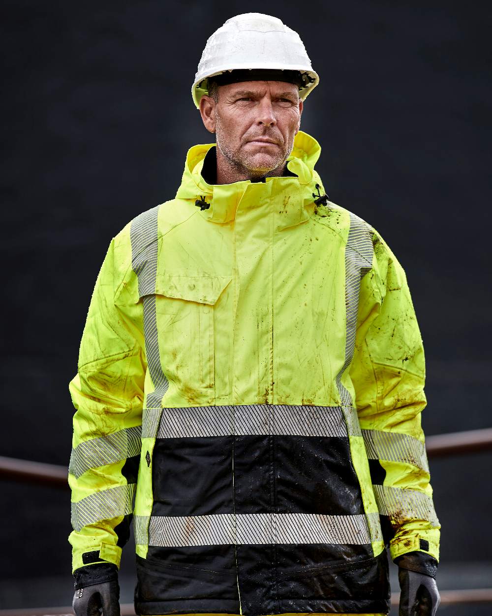 Fluorescent Yellow Black Coloured Elka Mens Visible Xtreme Stretch Winter Jacket on black background 