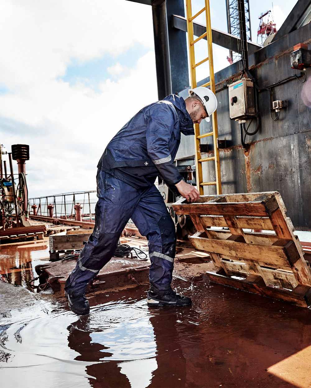 Navy Black Coloured Elka Mens Working Xtreme Stretch Jacket on construction background 