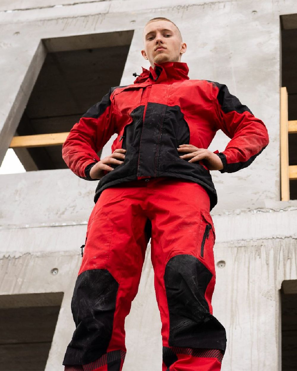 Red Black Coloured Elka Mens Working Xtreme Stretch Waist Trousers on building background 