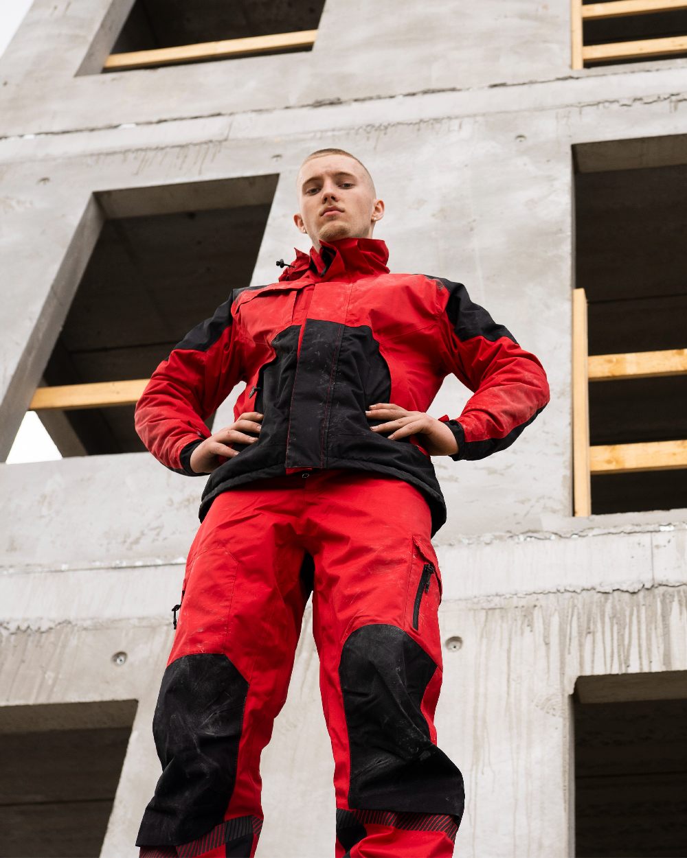 Red Black Coloured Elka Mens Working Xtreme Stretch Winter Jacket on building background 