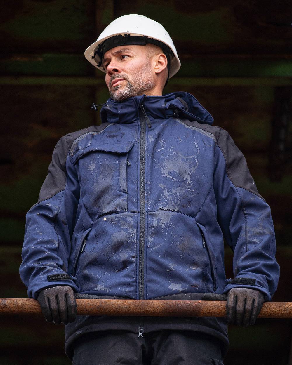 Navy Black Coloured Elka Mens Working Xtreme Winter Softshell Jacket on blurry background 