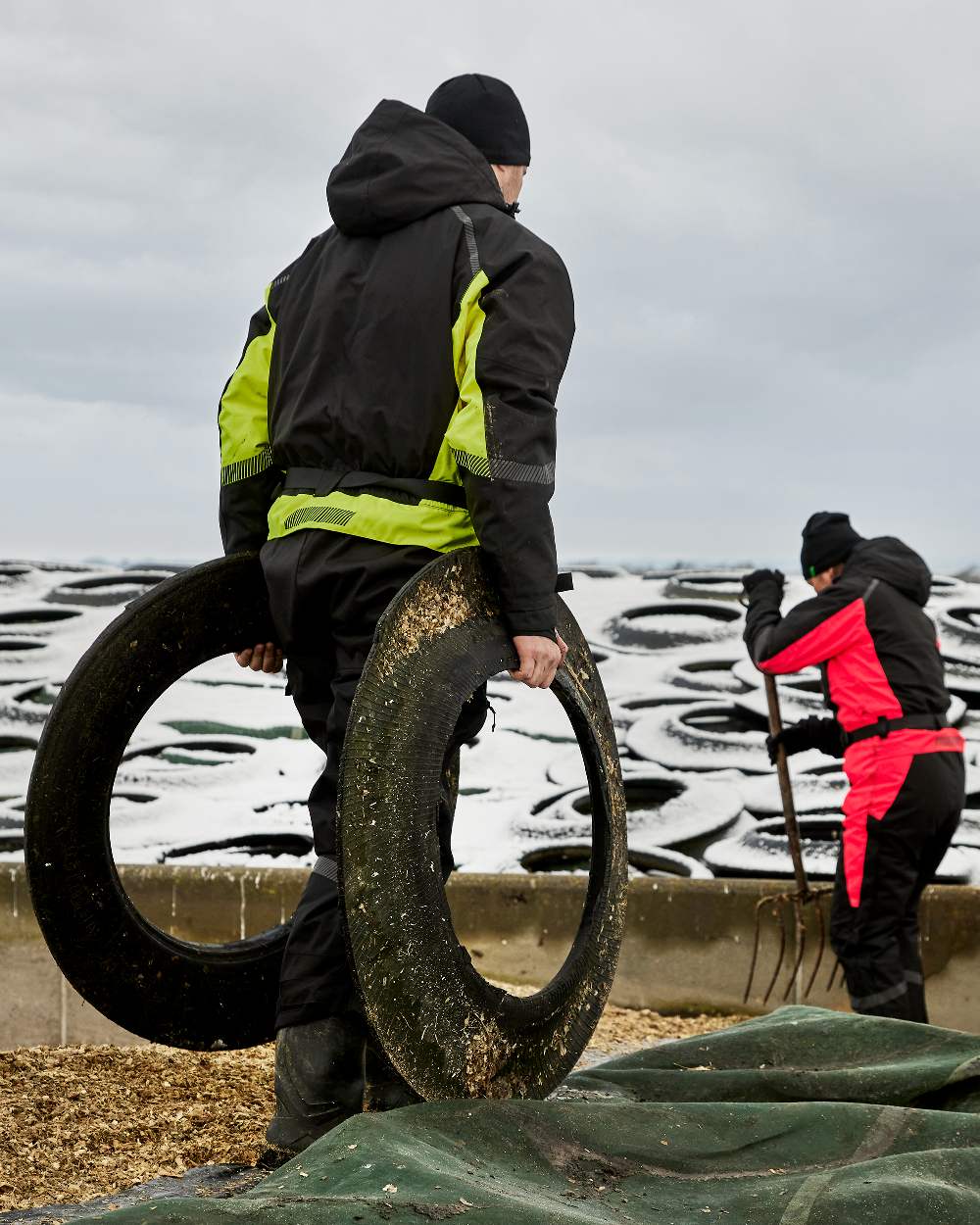 Black Fluorescent Yellow Coloured Elka Mens Working Xtreme Winter Thermal Coverall With Recycled Padding on snow background 
