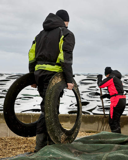 Black Fluorescent Yellow Coloured Elka Mens Working Xtreme Winter Thermal Coverall With Recycled Padding on snow background 