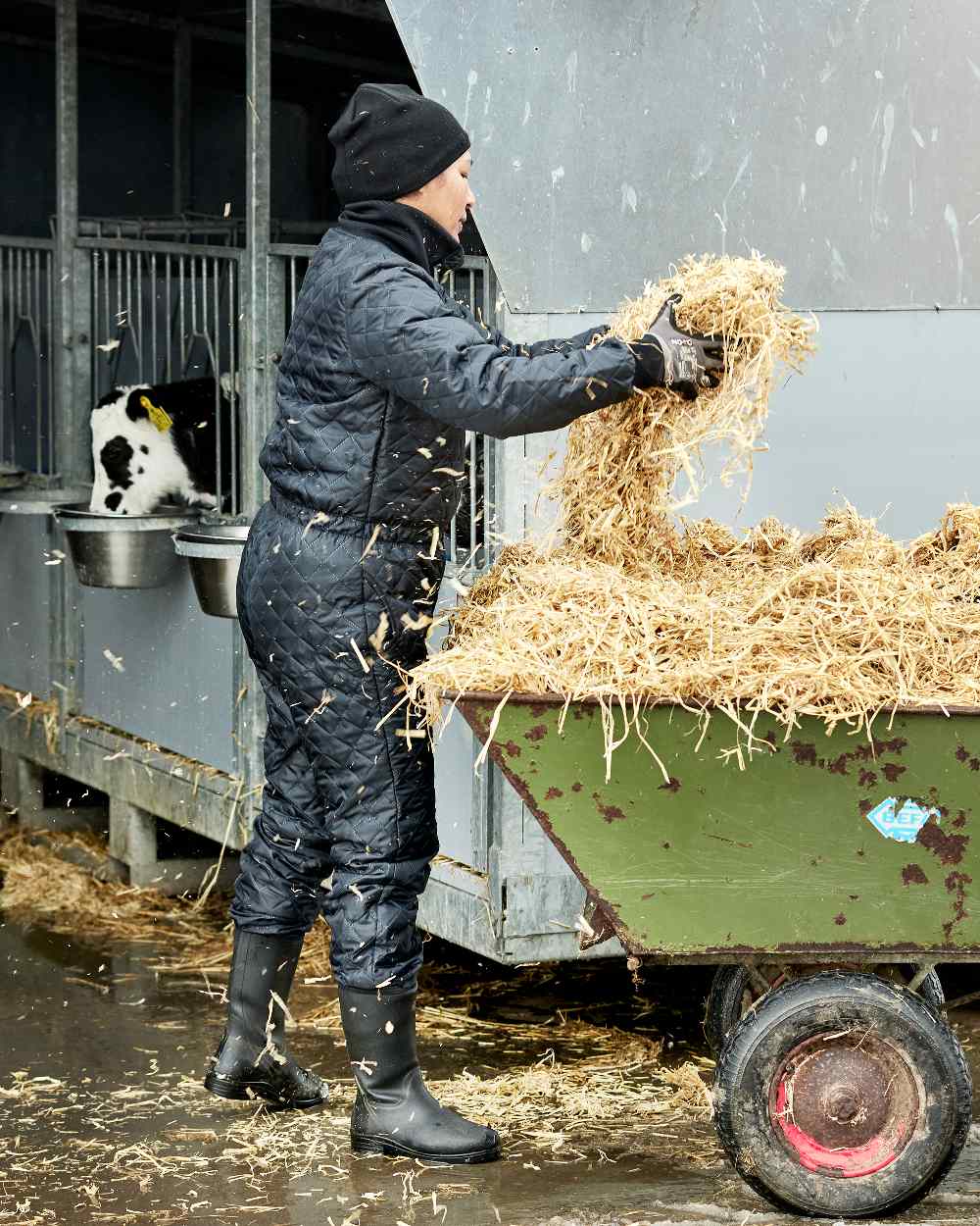 Black Coloured Elka Womens Thermal Coverall on barn background 