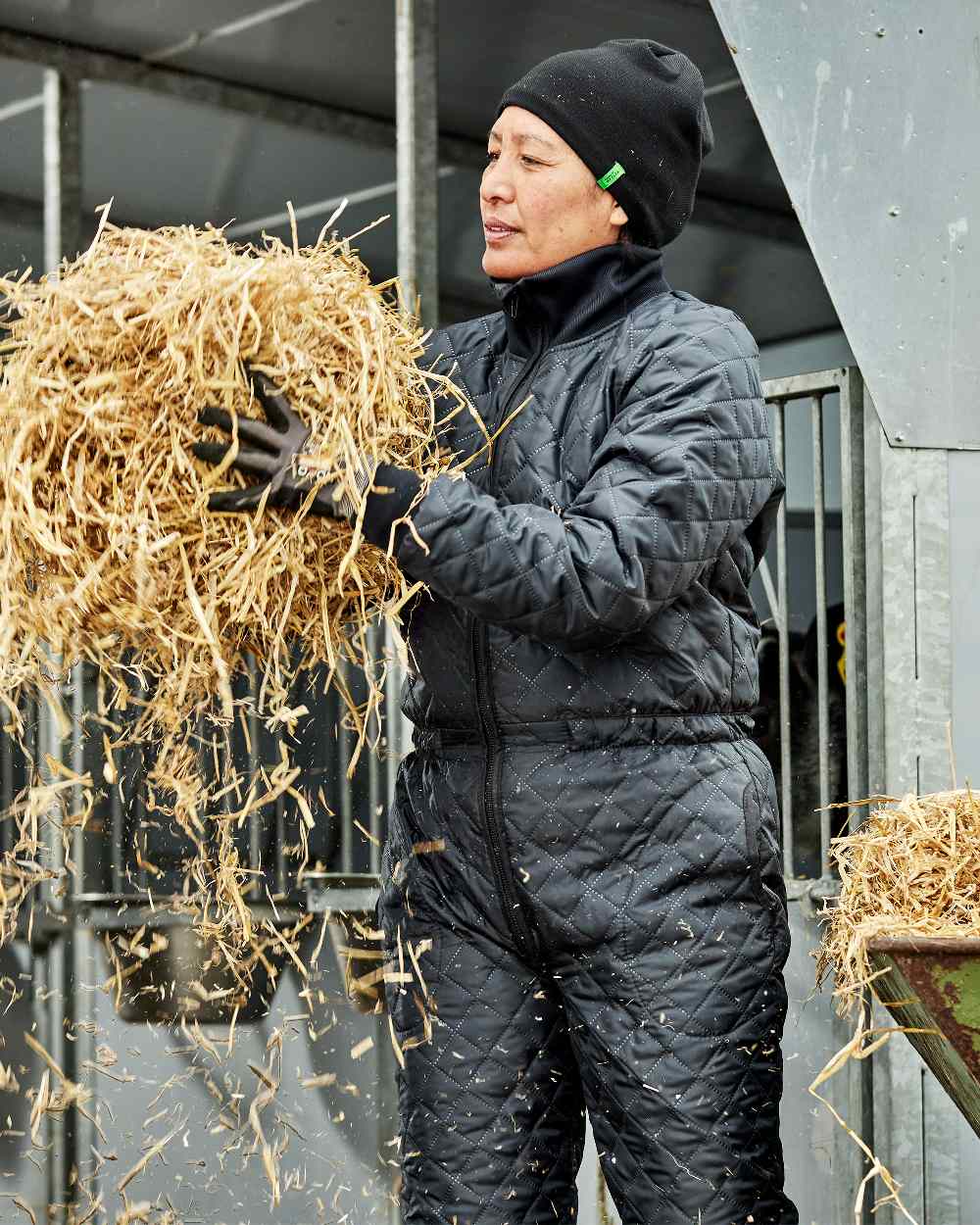 Black Coloured Elka Womens Thermal Coverall on barn background 