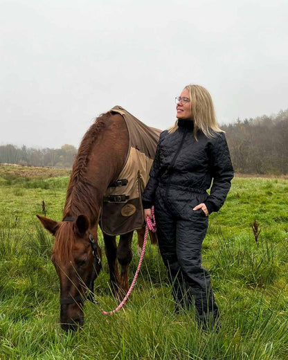 Black Coloured Elka Womens Thermal Coverall on countryside background 