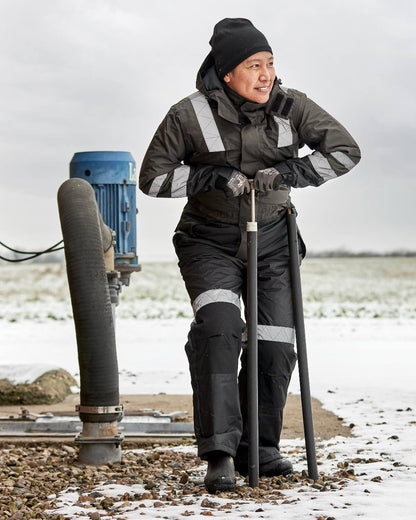 Grey Black Coloured Elka Womens Working Xtreme Winter Thermal Coverall on snow background 