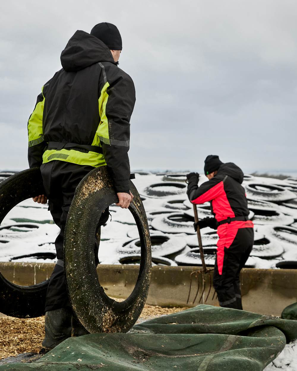 Black Red Coloured Elka Womens Working Xtreme Winter Thermal Coverall With Recycled Padding on snow background 