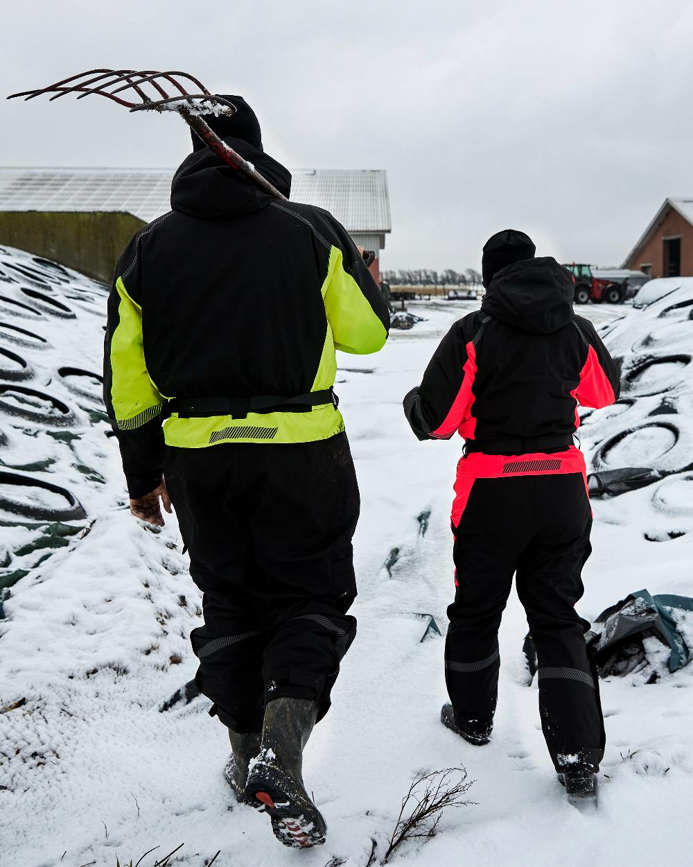 Black Red Coloured Elka Womens Working Xtreme Winter Thermal Coverall With Recycled Padding on snow background 