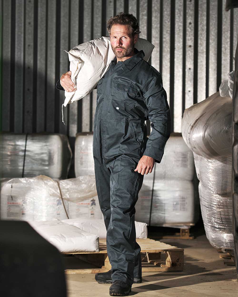 Green coloured Fort Stud Front Boilersuit on indoor background 