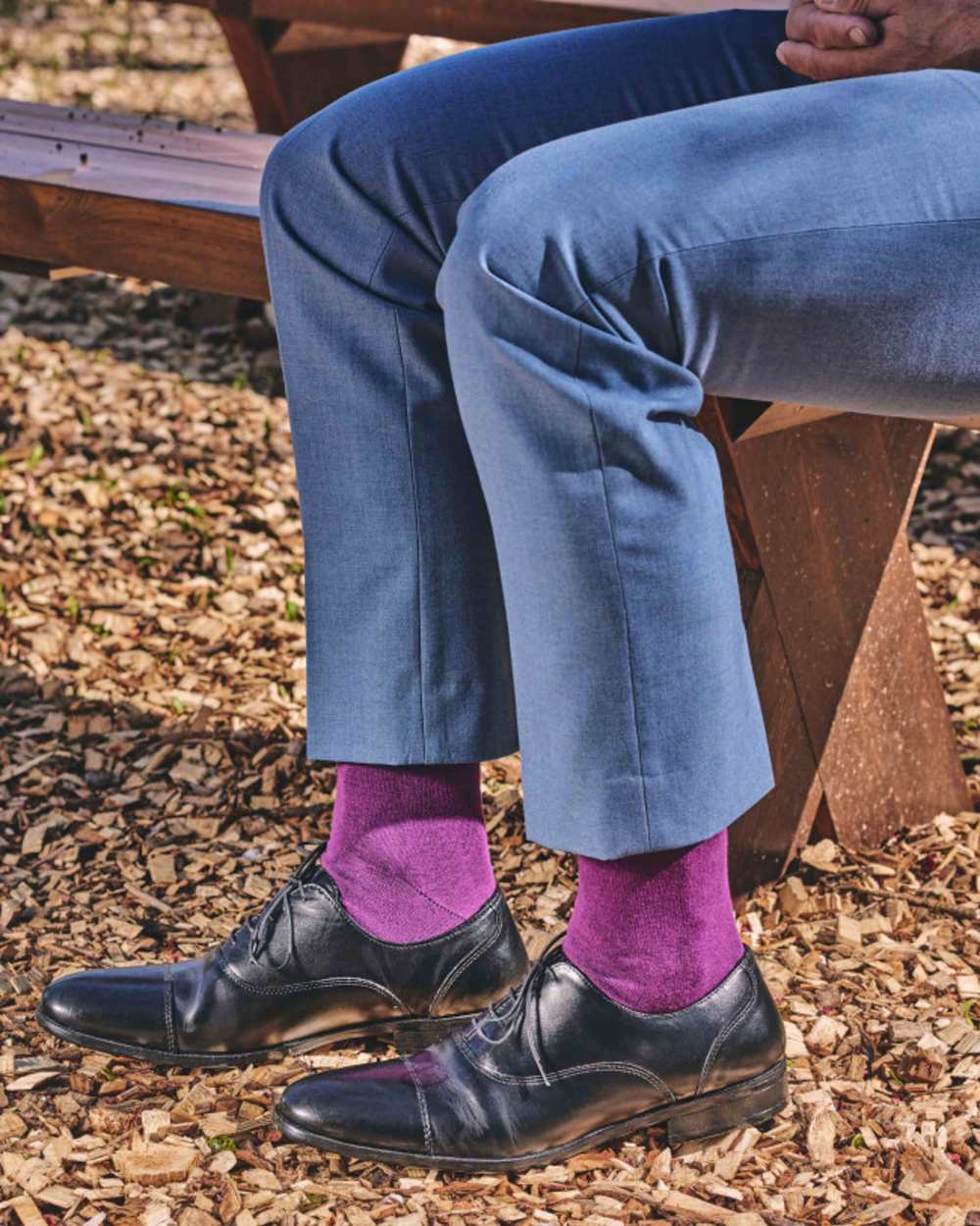 Plum coloured HJ Hall Classic Cotton Fashion Socks on ground background 