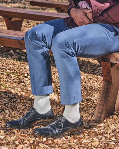 Sea Mist coloured HJ Hall Classic Cotton Fashion Socks on street background 