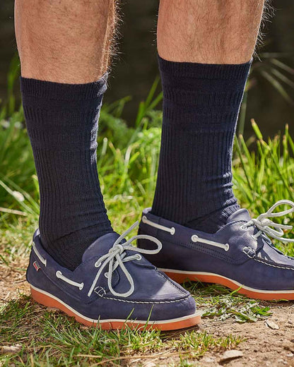 Navy coloured HJ Hall Extra Wide Soft Top Sock Sanitised Wool on grass background 
