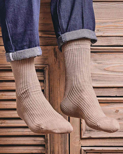 Oatmeal coloured HJ Hall Extra Wide Soft Top Sock Sanitised Wool on indoor background 
