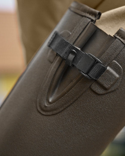 Dark Willow Green Coloured Harkila Forester Gusset Rubber Boots on outdoor background 