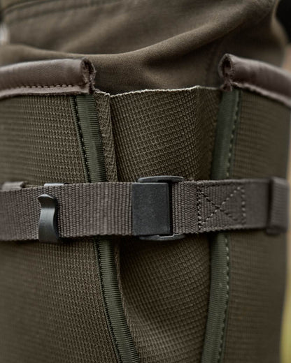 Willow Green Deep Brown Coloured Harkila Forester Zip Rubber Boot on outdoor background 