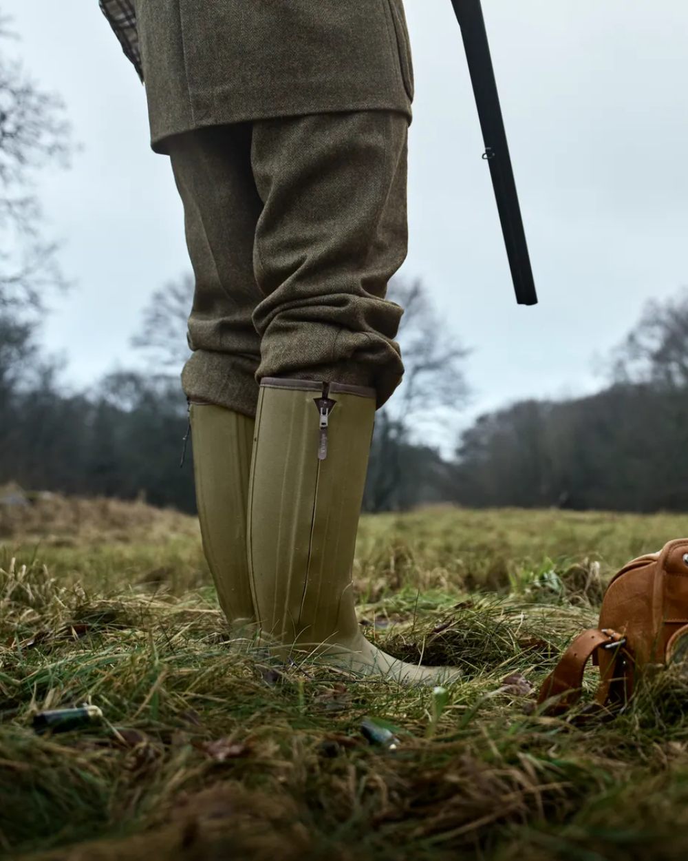 Dark Olive Coloured Harkila Forester Zip Rubber Boot on outdoor background