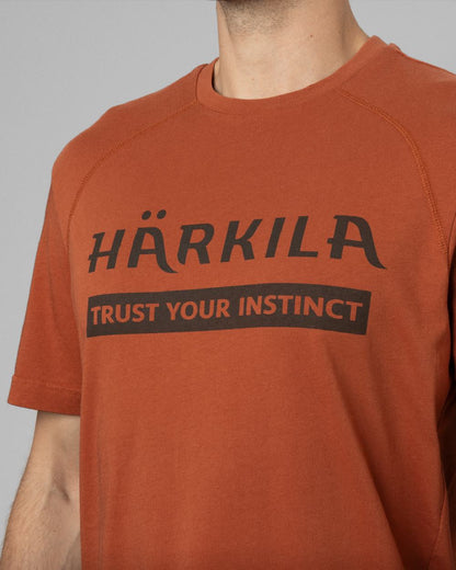 Arabian Spice Coloured Harkila logo Short Sleeve T-Shirt on outdoor background 