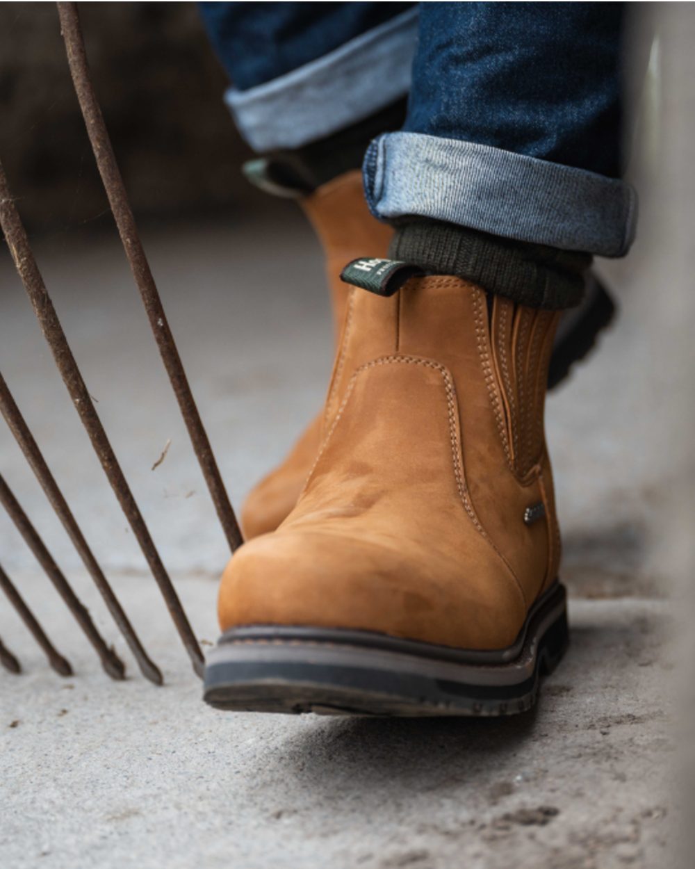 Waxy-Tan Coloured Hoggs of Fife Air-Shire Dealer Boots on Street background 