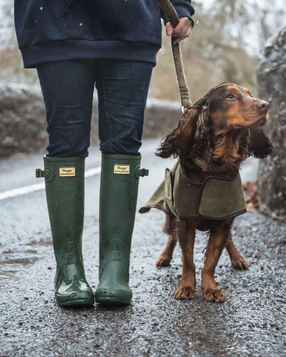 Green Coloured Hoggs of Fife Braemar Wellingtons on countryside background 
