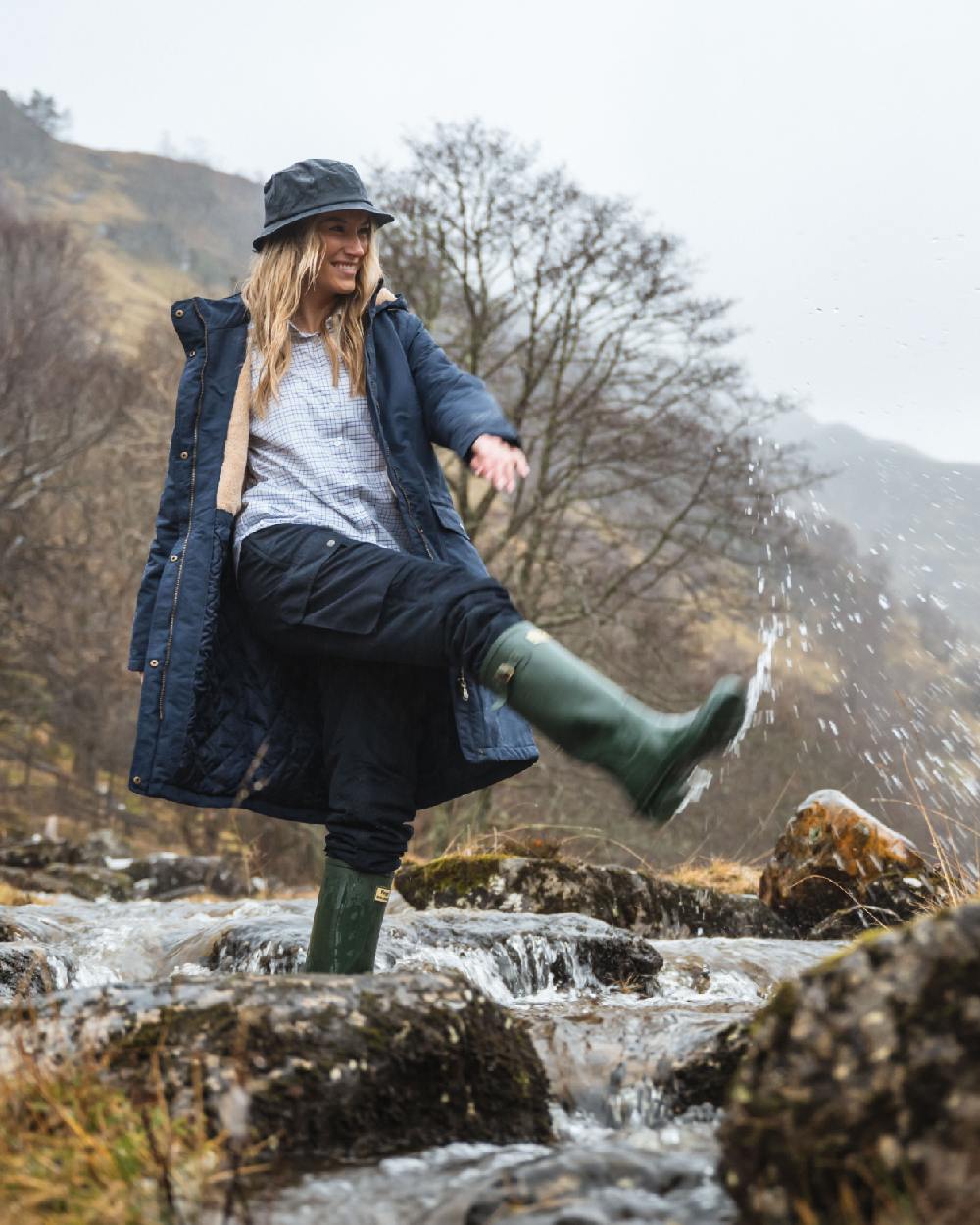 Green Coloured Hoggs of Fife Braemar Wellingtons on forest background 