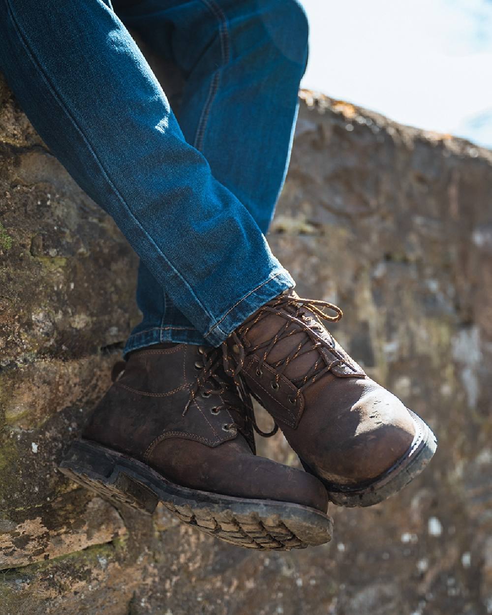 Crazy Horse Brown Coloured Hoggs of Fife Cronos Pro Boot on wall background 