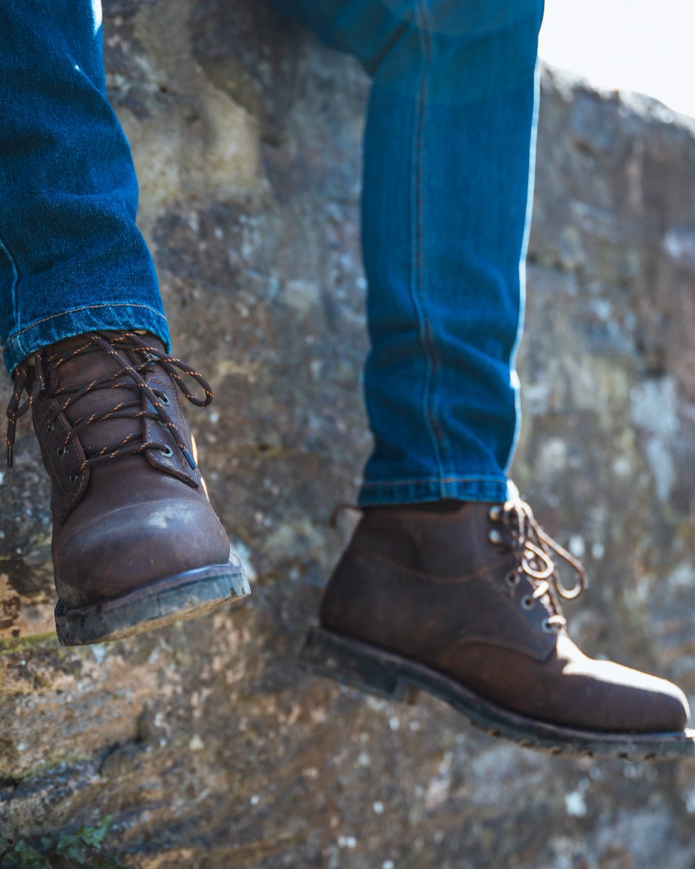 Crazy Horse Brown Coloured Hoggs of Fife Cronos Pro Boot on wall background 