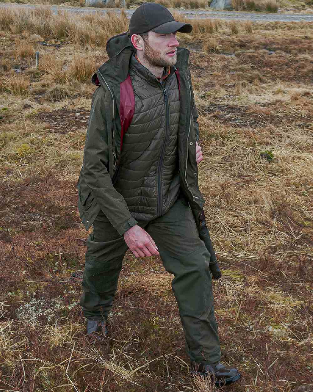 Fen Green Coloured Hoggs of Fife Culloden Waterproof Trousers on land background 