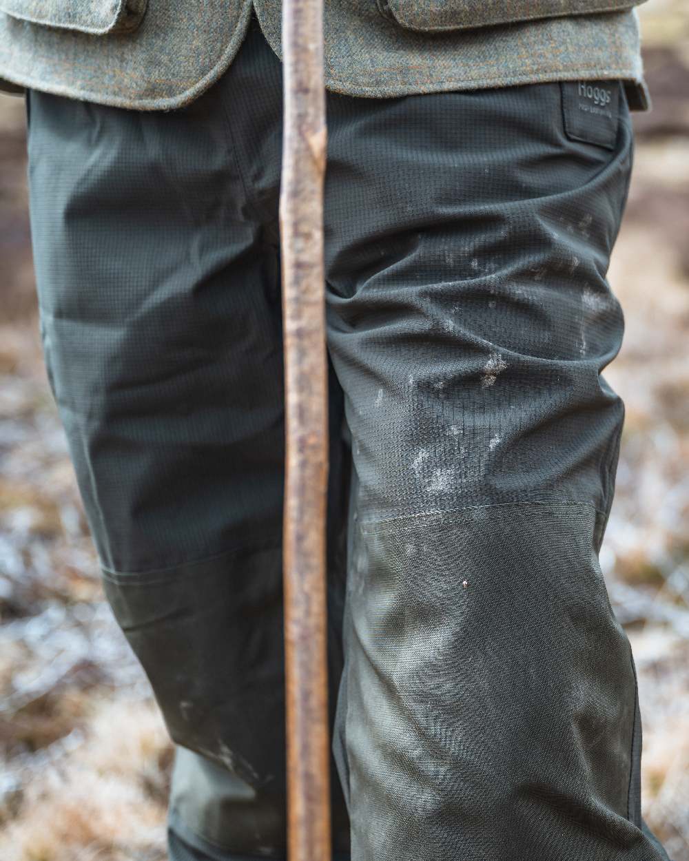 Green Coloured Hoggs of Fife Green King II Waterproof Trousers on barn background 