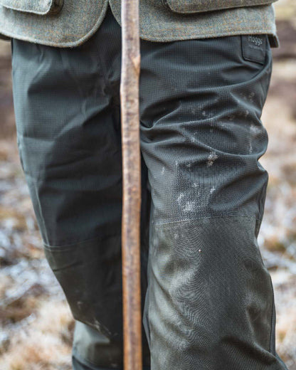 Green Coloured Hoggs of Fife Green King II Waterproof Trousers on barn background 