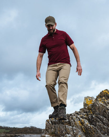 Bordeaux Coloured Hoggs of Fife Largs Pique Polo Shirt on sky background 