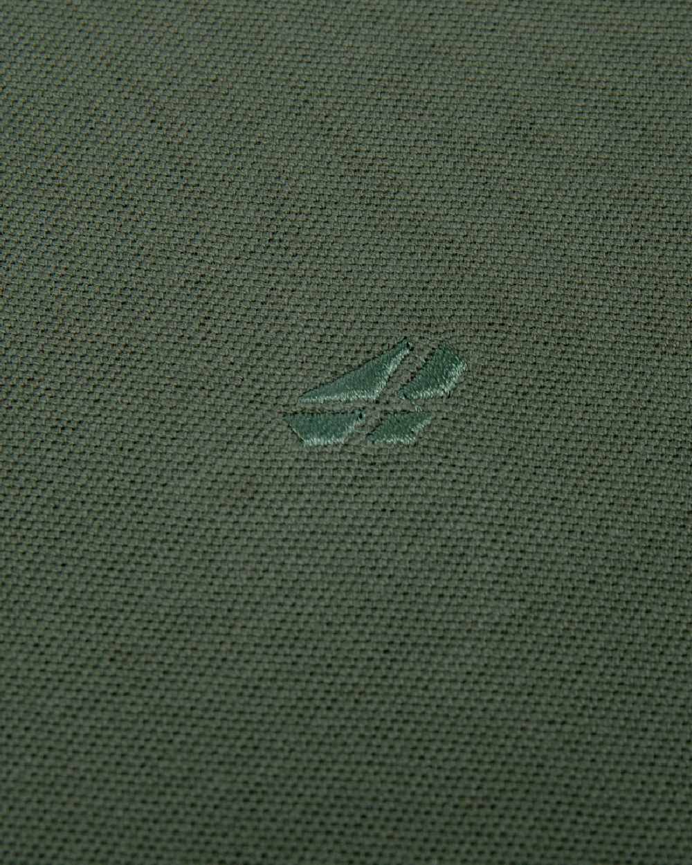 Bottle Green Coloured Hoggs of Fife Largs Pique Polo Shirt on white background 