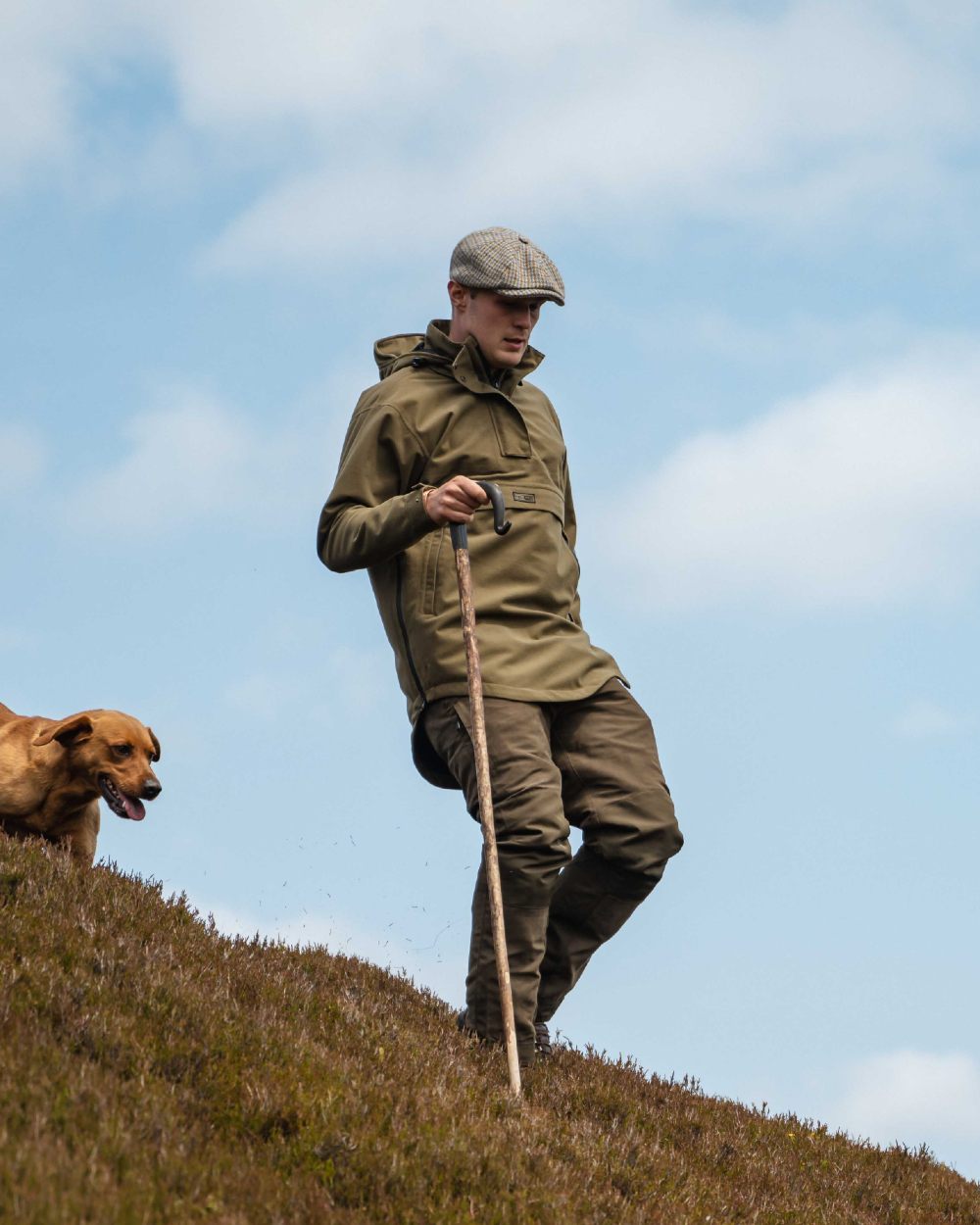 Olive Coloured Hoggs of Fife Mens Torness Trilaminate Waterproof Smock on sky background 