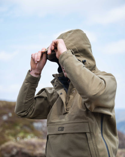 Olive Coloured Hoggs of Fife Mens Torness Trilaminate Waterproof Smock on sky background 